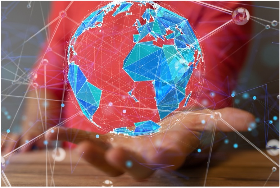 Hand holding a digital globe representing global AI connectivity